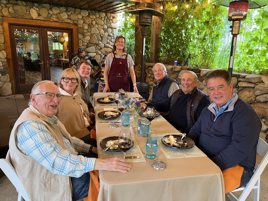 Guests enjoying outdoor dinner at the lodge