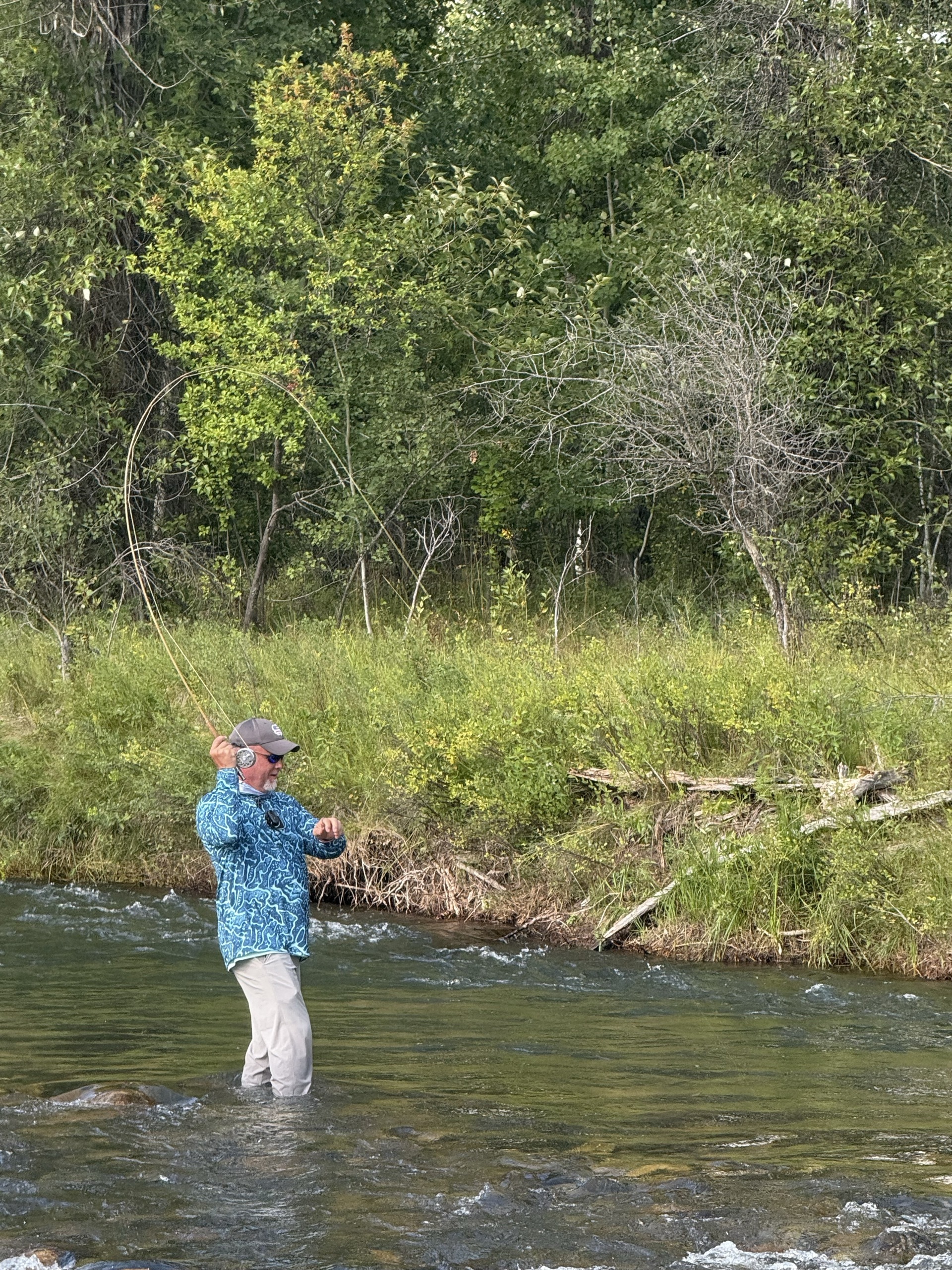 Guide and angler working a run