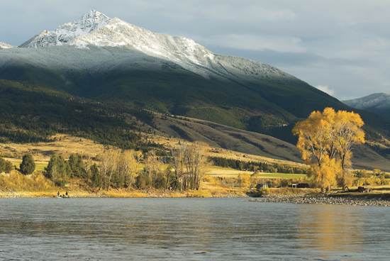 Snow-capped Absaroka peak over the Yellowstone River in autumn