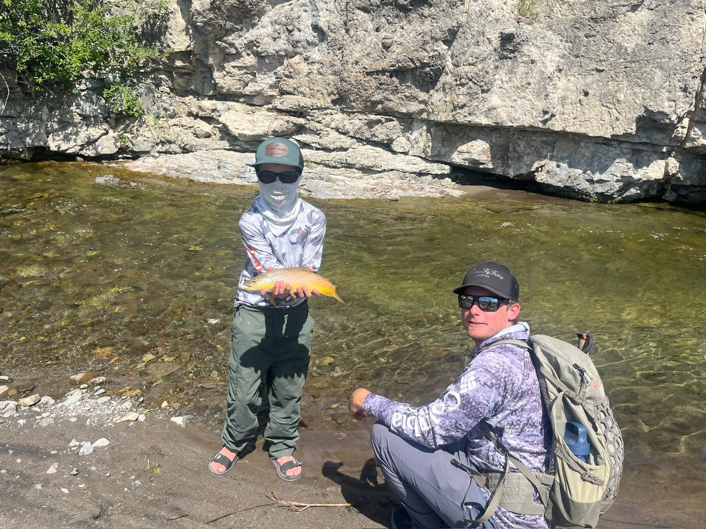 Guide and client moment at the end of the day on the spring creek