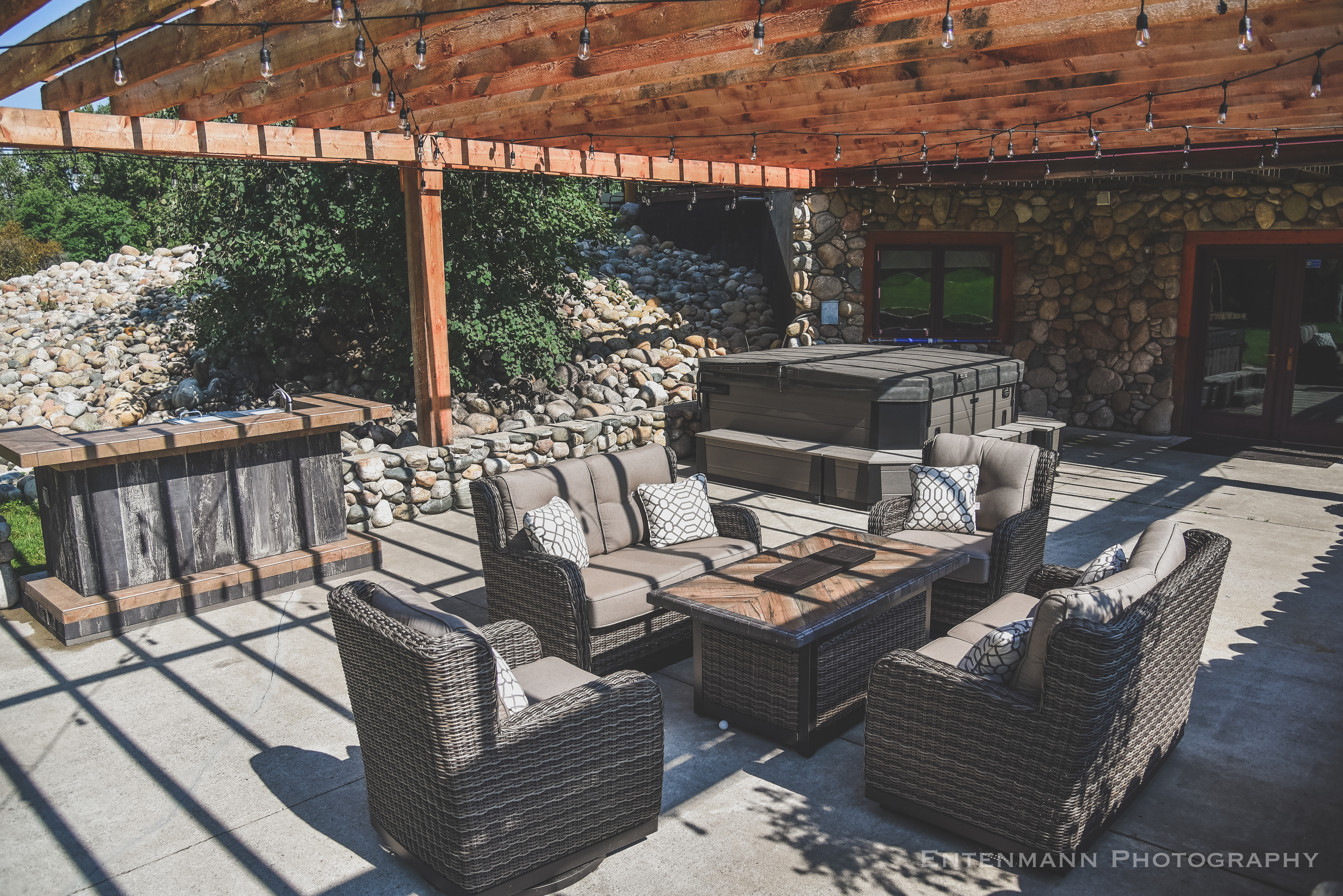 Outdoor patio with comfortable seating and string lights
