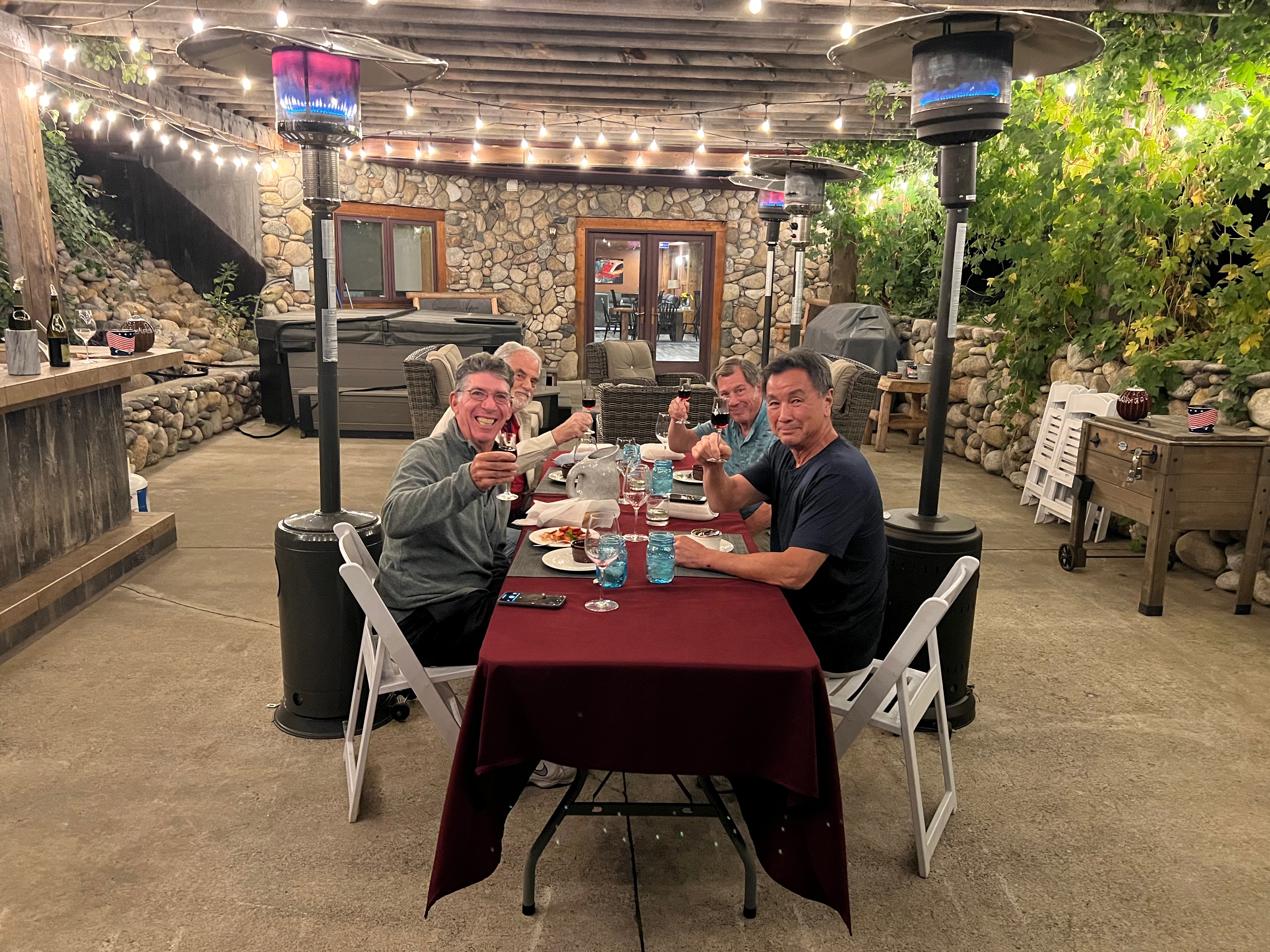 Friends enjoying dinner on the stone patio